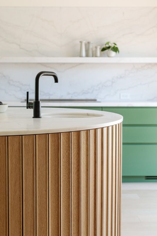 curved bench black tap kitchen stone splashback marble timber joinery