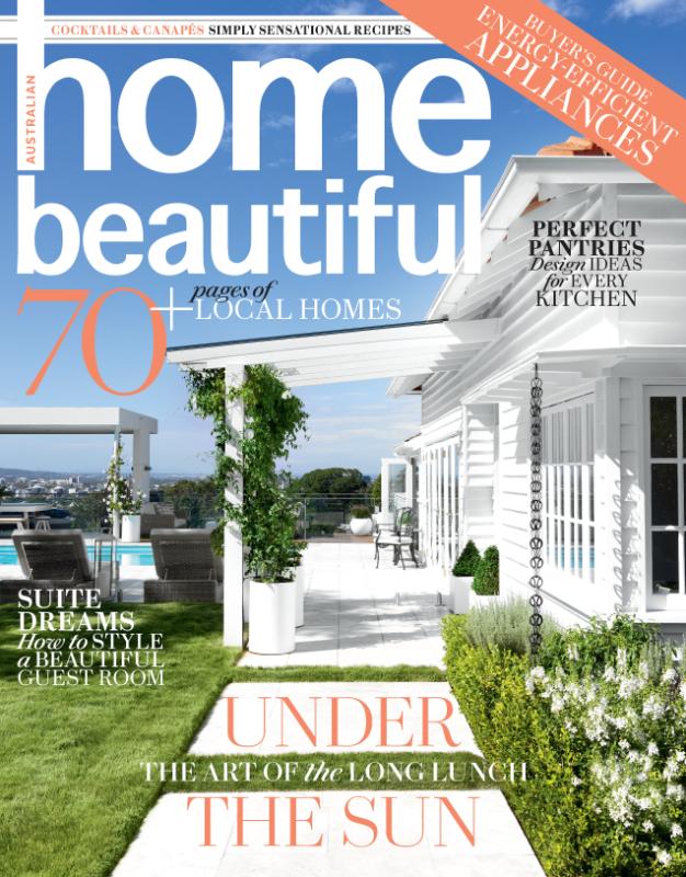 Magazine cover showcasing an upscale outdoor living space with articles on home design and energy-efficient appliances.