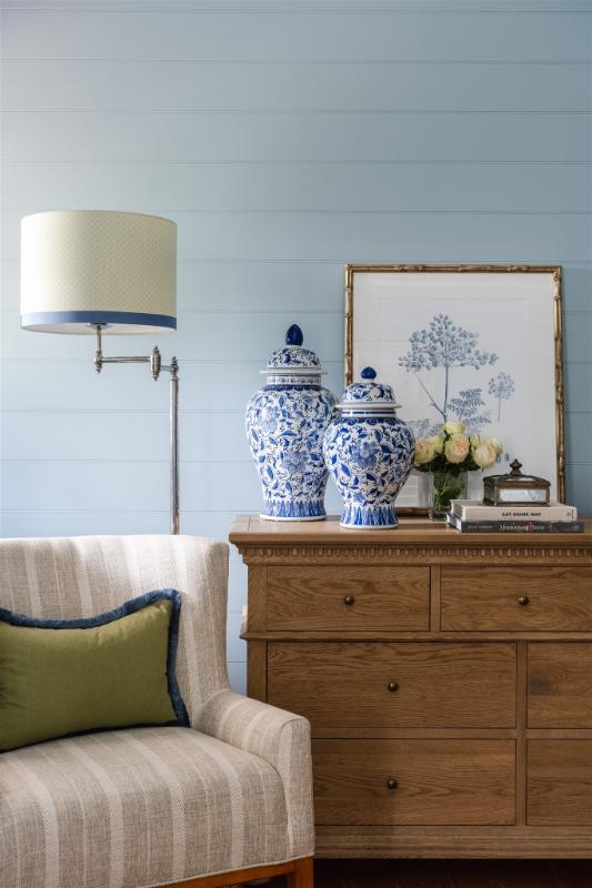 Timeless interior styling with blue and white ginger jars, classic timber drawers, floral artwork, and curated books — styled by Bella Vie Interiors in Bardon.